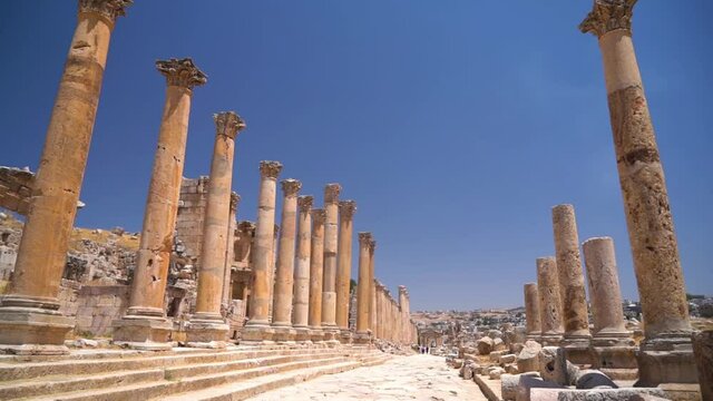 Colonnade Street in Ancient Greco Roman Gerasa City, Jerash, Jordan. Remains and Archaeological Site Under Blue Sky