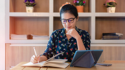 Young businesswoman working at home office - stock photo