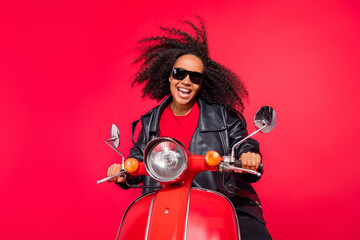 Fototapeta na wymiar Portrait of crazy funny funky person driving fast speed bike have fun isolated on red color background