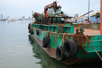 Big old rusty ship at a port