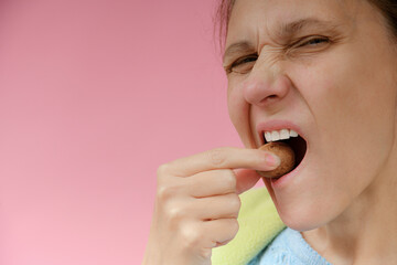 Strong teeth and hard walnut. The concept of dentistry and proper nutrition.