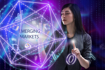Business, Technology, Internet and network concept. Young businessman working on a virtual screen of the future and sees the inscription: Emerging markets