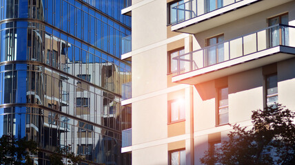 Corporate architecture building. New modern office building. Textured blue pane of contemporary glass architectural building. Sunlight.