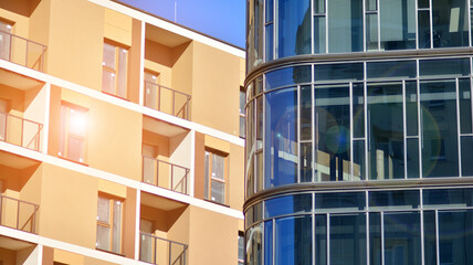 Corporate architecture building. New modern office building. Textured blue pane of contemporary glass architectural building. Sunlight.