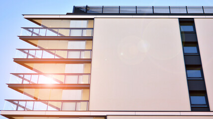 Modern apartment building. Modern urban architecture and details of building facade. Sunlight.