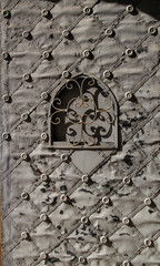 Old forged gray metal door in Spain