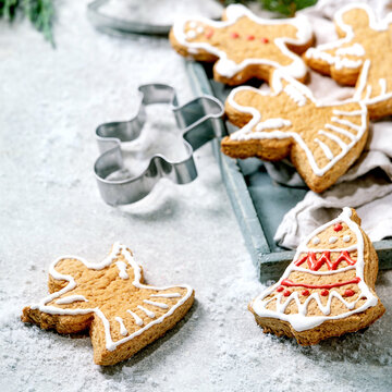 Christmas gingerbread cookies with icing ornate. Xmas decorations, white background.