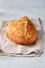 Loaf of bread on white background, food closeup.