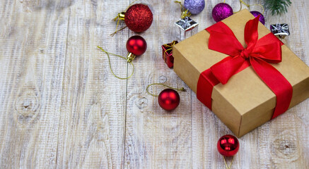 Christmas box of New Year's toys on a wooden background.