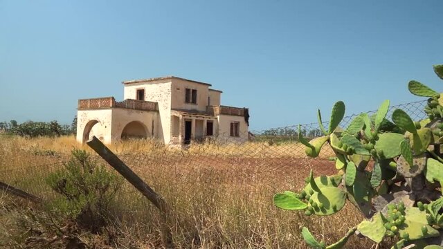 South Italy. Summer 2021. Countryside panorama with abandoned house