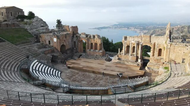 Morning Aerial drone shot taken in summer 2021 showcasing the Amphitheatre of Taormina, Sicily, Italy.