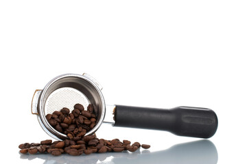 One metal holder with coffee beans for a coffee machine, close-up, isolated on white