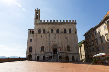 Fototapeta na wymiar Beautiful view of Palazzo dei Consoli, a medieval building facing the scenic Piazza Grande in Gubbio, Umbria, central Italy.