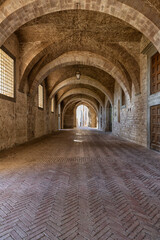 Fototapeta na wymiar Games of light that filters through the windows inside the Palazzo Ducale in Gubbio