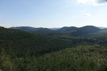 Scenic view over Palatinate Forest and the Vosges from majestic outlook point Bayerischer Windstein at the German French border, Obersteinbach, France

