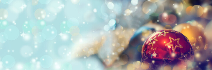 Christmas panoramic background with balls, snowflakes and bokeh.