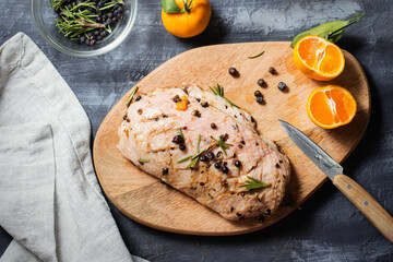 Cooking duck breast with tangerines and rosemary. Baked duck with juniper. Preparation. Raw meat is...