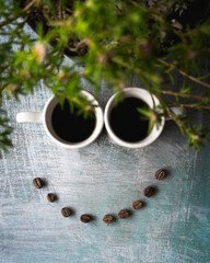 Smiling face with cups of coffee 