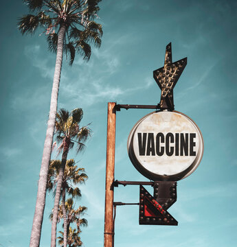 Aged and worn photo of vaccine sign with arrow