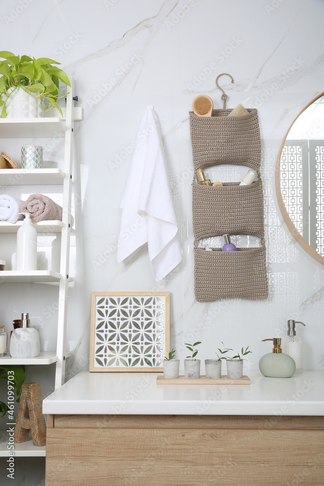 Sticker Knitted organizer hanging on wall in bathroom