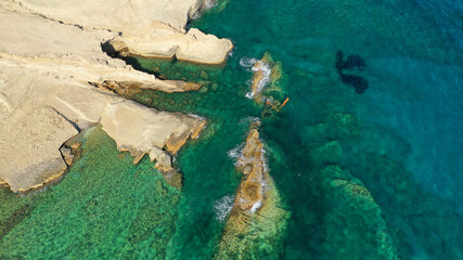 Aerial drone photo of sunk shipwreck near famous bay of Sarakiniko, Milos island, Cyclades, Greece