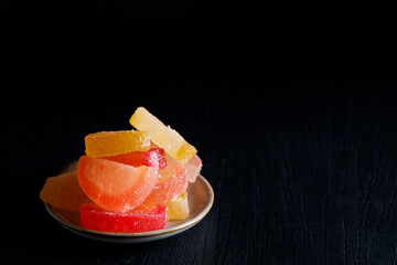 Traditional candy . Traditional candy, colorful agar slices in the form of a orange wedge.