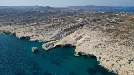 Obraz premium Aerial drone photo of iconic lunar volcanic white chalk beach and caves of Sarakiniko, Milos island, Cyclades, Greece