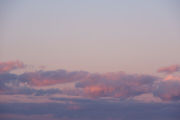 Fiery pink sunset sky. Beautiful perfect sky for your photos. Cloudscape of cumulus sunset clouds with sunlight