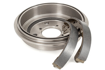 Asbestos brake pads and drum, replacement spare parts of the car brake system, isolated on white...