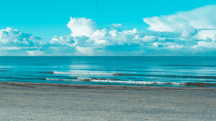 Panoramic landscape sunny photo of beautiful and amazing blue sea and blue sky with clouds