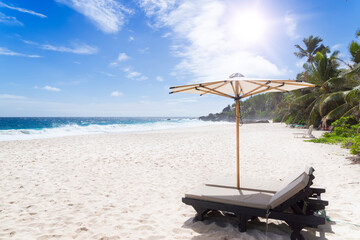 Obraz na płótnie Canvas Beach chair at sunny coast. Seychelles.
