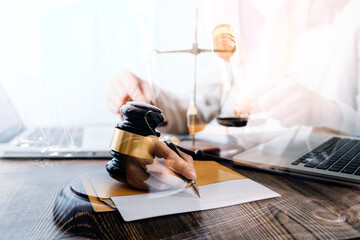 Business and lawyers discussing contract papers with brass scale on desk in office. Law, legal services, advice, justice and law concept picture with film grain effect