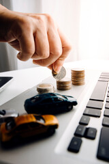 car and key on stacks of coin, car loan concept, Saving money for car concept, trade car for cash concept, finance concept.