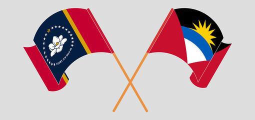 Crossed and waving flags of The State of Mississippi and Antigua and Barbuda
