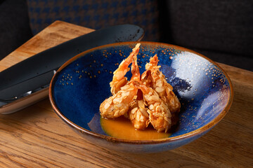 Hot Spicy Fried Shrimps in Bowl. Crispy Prawns in , Chilli Sauce