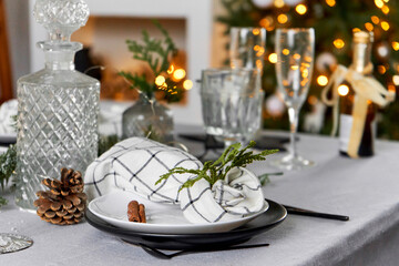 Light festive Christmas interior, set table for a festive dinner