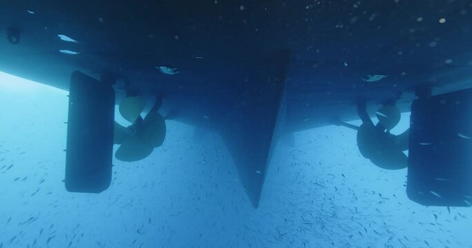 Small Fish Under Hull Of Large Boat.