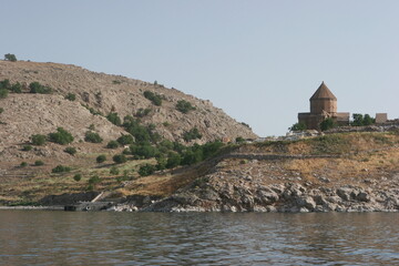 The Cathedral of the Holy Cross  on Aghtamar Island, in Lake Van in eastern Turkey, is a medieval Armenian Apostolic cathedral, built as a palatine church for the kings of Vaspurakan and later servin