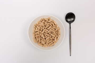 A lot of vitamin pills in a plate