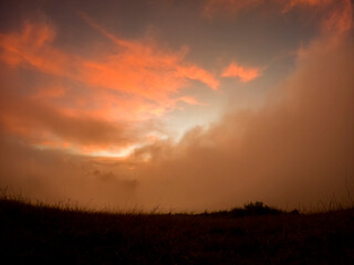 View of the sunrise in the mist from top of 'Le Pouce' mountain