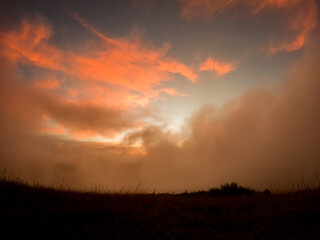 View of the sunrise in the mist from top of 'Le Pouce' mountain