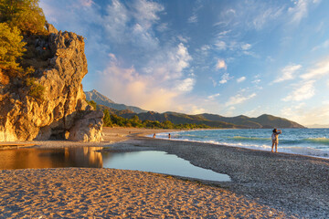 Fototapeta premium Cirali Olympos beach at sunrise. Sea and mountains. Kemer, Antalya, Turkey.