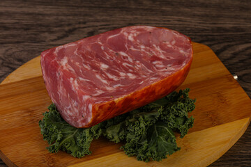 Beef ham piece over board