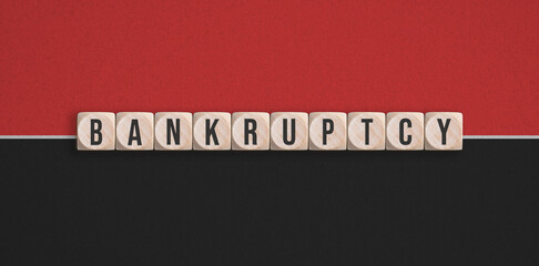 Fototapeta na wymiar cubes with the message BANKRUPTCY on red and black background