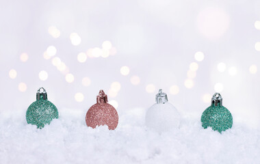 christmas bells in the snow on the white background with christmas lights