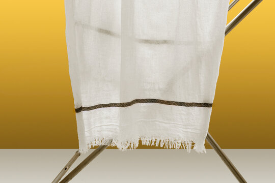 Kerala White Cotton Bath Towel Or Thorthu Hanging On Cloth Stand For Dry