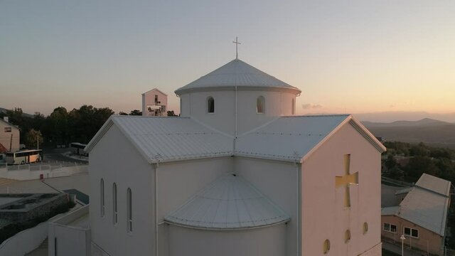 Catholic Church of the Croatian Martyrs Croatia, Udbina, Croatia Modern new Church of the Croatian Martyrs The cornerstone was blessed by the Pope John Paul II. Statue of Pope John Paul II in front 
