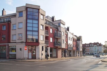Fototapeta na wymiar Contemporary buildings at Bielska Street in Plock on a sunny afternoon.