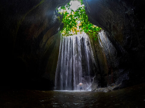 View of Tukad Cepung waterfall hidden in a cave located at Tembuku, Bali