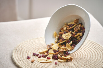 Crunchy tropical muesli pile mix with banana,